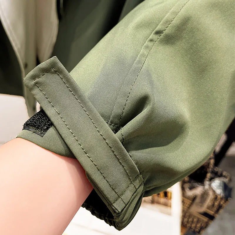 NATI | Veste à capuche en deux couches, fermée par des boutons-pression et une fermeture éclair